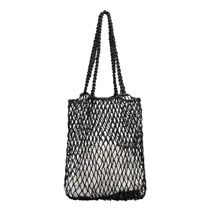 Handmade black woven cotton mesh tote bag with a removable inner drawstring pouch