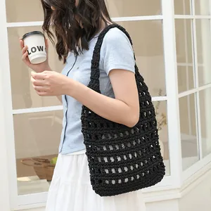 Handmade black woven crochet shoulder bag with a stylish hollow-out design for women