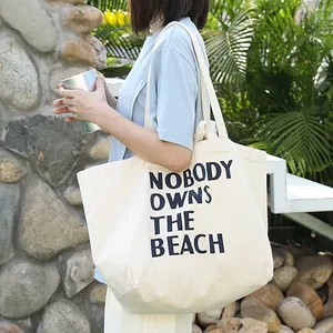 Bolso de lona blanco roto informal con el estampado de NOBODY OWNS THE BEACH