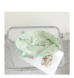 Top view of nylon tote bag interior showing green and white striped lining detail