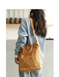 Lifestyle view of a washed kraft paper tote bag showing its unique crinkled textures