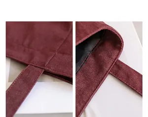 Primer plano del tejido denim rojo duradero y las costuras prolijas en el asa de un bolso