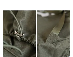 Detalle del cierre de cordón y costuras reforzadas de una mochila de lona verde.