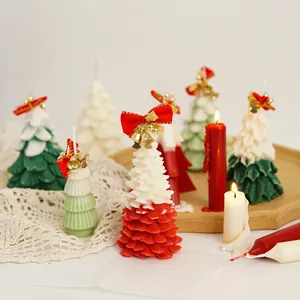 Detailed view of colorful Christmas tree scented candles for festive home decoration