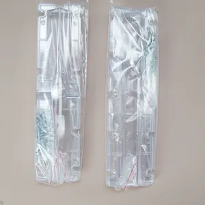 Macro detail of transparent square spiral twisted column candle mold and assembly screws