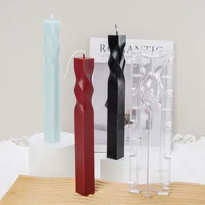 Clear PC plastic square spiral twist pillar candle mold shown with colorful wax samples