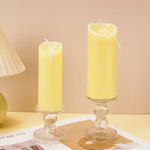 Detailed macro view of yellow wave-top pillar candles produced with acrylic DIY molds