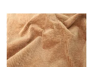 Primer plano de la textura de la tela de pana marrón de alta calidad para bolso