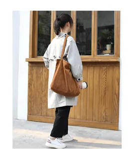Woman wearing brown retro corduroy shoulder bag with large capacity lifestyle view
