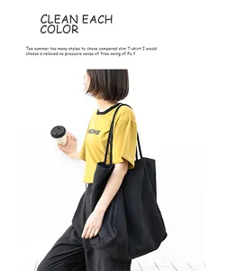 Side view of a large black washed canvas tote bag in a casual literary style