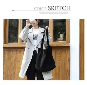 Large capacity casual black corduroy tote bag in a stylish outdoor lifestyle setting