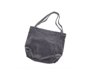 Macro view of dark grey corduroy tote bag showing soft ribbed fabric texture.