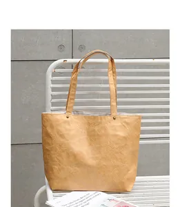Detail view of a retro-style DuPont paper tote bag with unique wrinkled texture