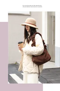 Large brown corduroy shoulder bag for women styled with model in casual urban setting