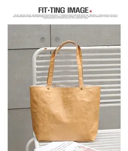 Close-up of vintage wrinkled DuPont paper tote bag on a white metal chair