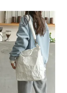 Detailed view of white washable kraft paper shoulder bag with wrinkled texture