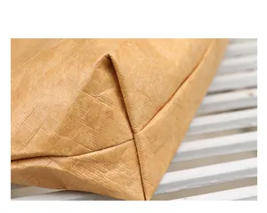 Close-up showing the unique wrinkled texture and seams of a brown Dupont paper bag