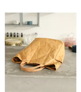 Casual DuPont paper tote bag with unique wrinkled texture shown on a stone surface