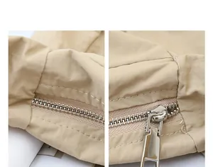 Close-up of high-quality silver metal zipper on beige nylon shoulder bag
