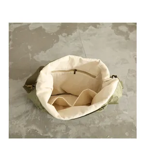 Interior detail of DuPont paper shoulder bag with zippered pocket and lining.
