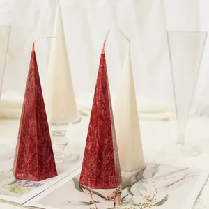 Detailed texture view of red and white hexagonal tapered candles in a Nordic setup