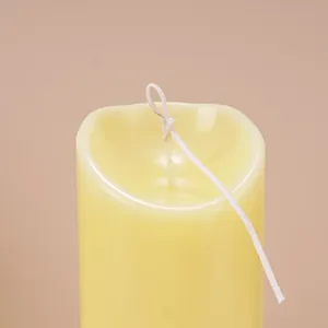 Close-up view of the unique wave-shaped top detail on a cylindrical DIY scented candle mold