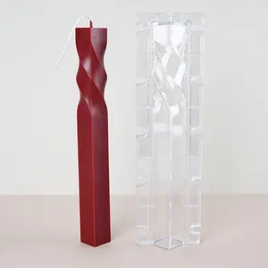 Geometric spiral twisted pillar candle mold shown with finished deep red wax sample