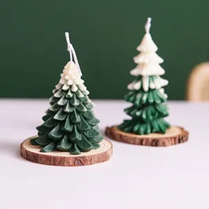 Close-up detail of green Christmas tree scented candles on natural pine wood coasters