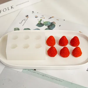 Close-up of a 6-cavity strawberry silicone mold for making DIY resin art or candles