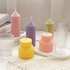 Detail view of ribbed geometric aromatherapy candles and transparent plastic molds.