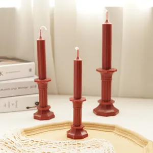 Detailed view of elegant deep red octagonal pillar candles crafted from DIY plastic molds