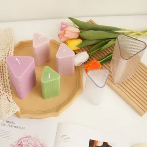 Detailed view of triangle ribbed candle molds and finished textured geometric candles