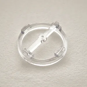 Close-up detail of a transparent plastic wick centering tool for DIY aromatherapy candle making