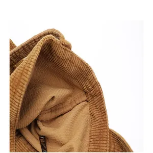 Macro close-up view showing the high-quality brown corduroy fabric and stitching details