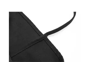 Macro detail showing durable black canvas strap with reinforced stitching quality
