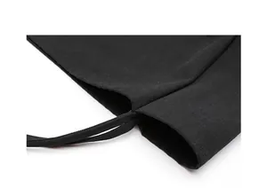 Close-up detail of black washed canvas tote bag showing strap attachment and texture