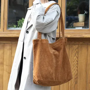 Retro large capacity brown corduroy tote bag for women in casual lifestyle setting
