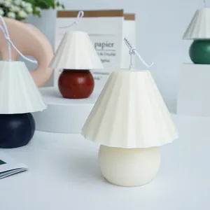Elegant pleated table lamp shaped scented candles with spherical base in cream and navy blue