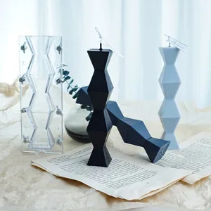 Geometric infinite pillar candle mold with finished black and grey candles for DIY craft