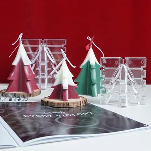 Detailed view of Christmas tree candle DIY plastic molds and finished handmade candles