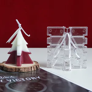 Detailed view of cross-shaped Christmas tree candle mold with two-tone finished sample