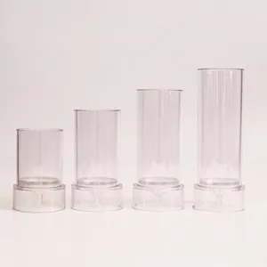 Set of four transparent cylindrical plastic candle molds in various sizes