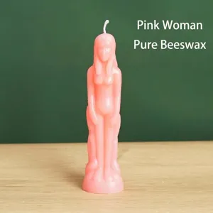 Detailed view of a pink female body figure candle made of pure natural beeswax material