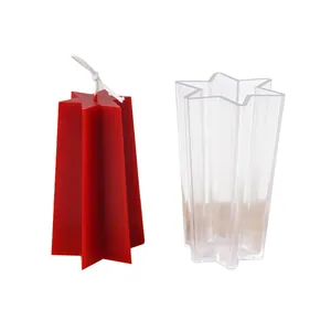 Transparent acrylic hexagram star candle mold shown with finished red wax candle