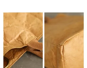Close-up detail showing the wrinkled texture and stitching of a washed kraft paper bag.