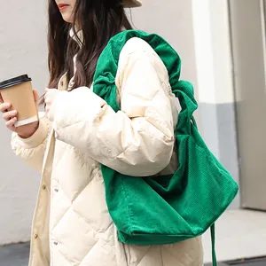 Stylish green corduroy shoulder bag for women with retro drawstring design and casual vibe