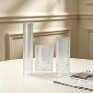 Detail view of three vertical ribbed plastic candle molds in high, medium and low sizes