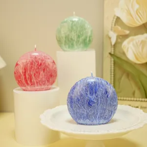 Detailed view of spherical scented candles with textured crystal finish in various colors