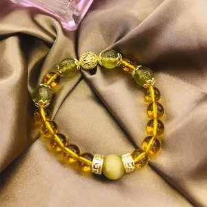 Elegante pulsera de cuentas de cuarzo rutilado dorado y citrino con detalles dorados