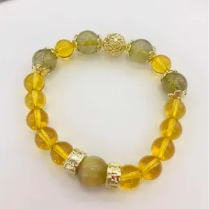 Elegante pulsera hecha a mano de citrino amarillo y cuarzo rutilado con detalles dorados